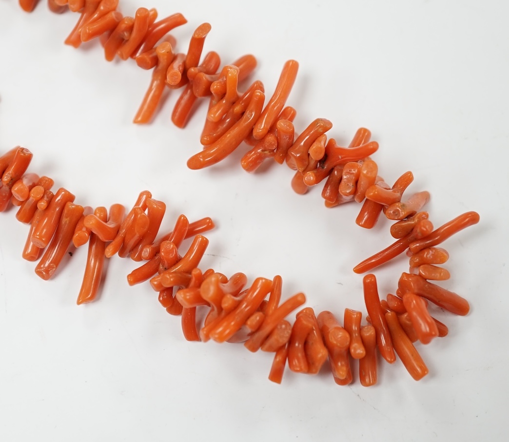 A single strand coral bead and branch necklace, with 375 clasp, 42cm, together with a pair of yellow metal and two stone coral bead drop earrings. Condition - fair